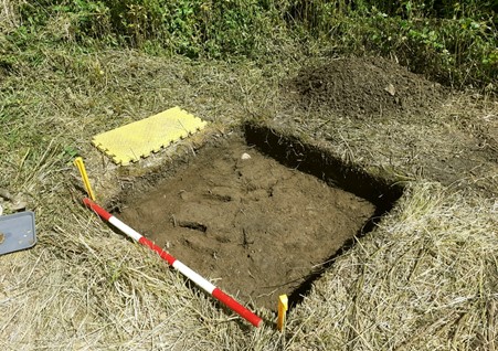 An image showing a test pit measuring one metre, dug by the Archaeological Society