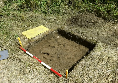 An image showing a test pit measuring one metre, dug by the Archaeological Society